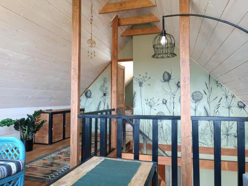 a room with a staircase in a house at Chatka na Wzgórzu in Morzyszów