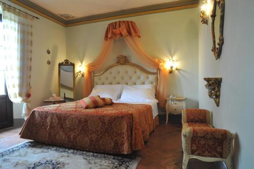 Postel nebo postele na pokoji v ubytování Relais Castelluccio Palusse
