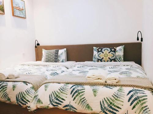 Ένα ή περισσότερα κρεβάτια σε δωμάτιο στο Infinity Guesthouse