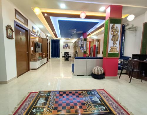 a lobby with a chess board on the floor at The Hideout Agra - Garden Homestay near Taj in Agra