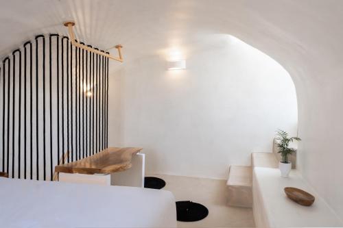 a living room with a white couch and a large organ at Grandma's Houses in Éxo Goniá