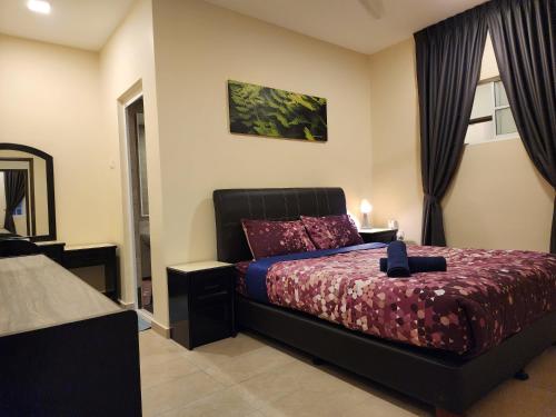 a bedroom with a bed and a window at Fathers Guesthouse Age 7 years old and above only in Tanah Rata