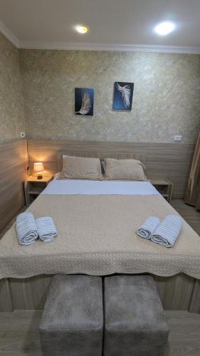 Postel nebo postele na pokoji v ubytování Dkd-bridge Hotel