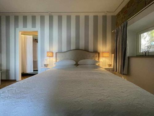 Ліжко або ліжка в номері Il nido della Moresca