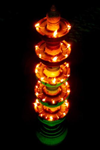 a stack of christmas lights in the dark at Elephant Courtyard- A Heritage Homestay in Alleppey