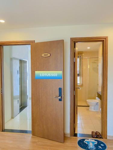 a lobby with a door with a sign on it at Resort royal lotus Ha Long in Ha Long