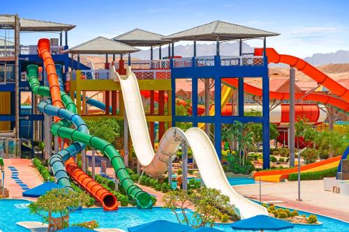a water park with a water slide and a water slide at Neverland City Hurghada - Pickalbatros in Hurghada