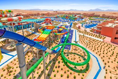an aerial view of a water park with a roller coaster at Neverland City Hurghada - Pickalbatros in Hurghada