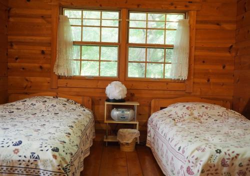 Un pat sau paturi într-o cameră la GlampHouse DAISEN Forest - Vacation STAY 30118v