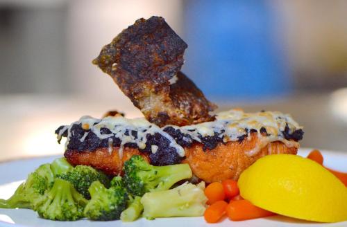 a plate of food with broccoli and a piece of meat at Hemus Hotel - Vratza in Vratsa