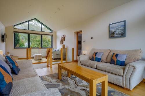 a living room with a couch and a table at The Old Police House in Grasmere