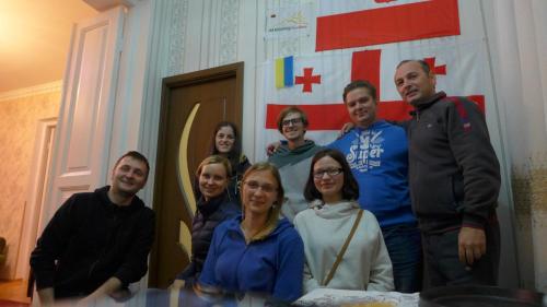 a group of people posing for a picture at Giorgi's Homestay in Kutaisi