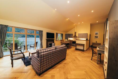 a living room with a couch and a table at Black Sheep Hotels Cabins in Spean Bridge