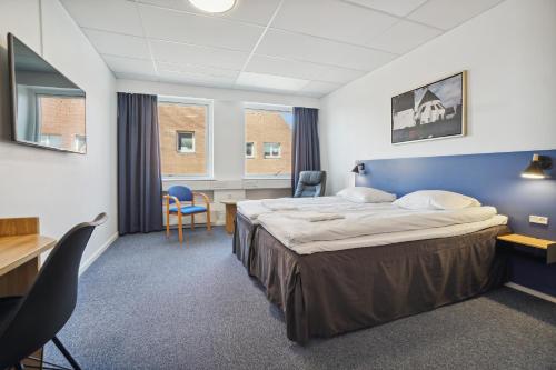 En eller flere senge i et værelse på BB-Hotel Rønne Bornholm