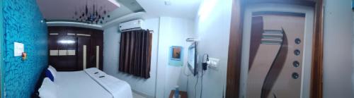 a bathroom with a toilet and a sink in it at gratifiedhomestay in Visakhapatnam