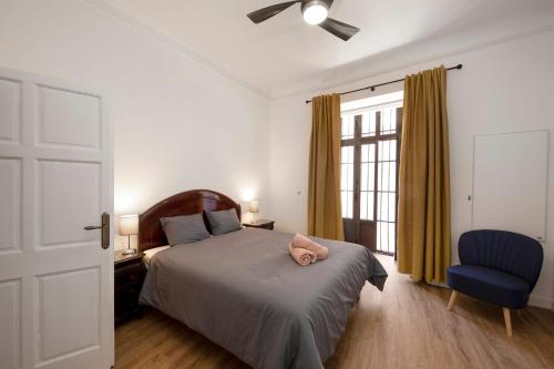a bedroom with a bed with a pink pig on it at PALACIO DON CARLOS in Jerez de la Frontera