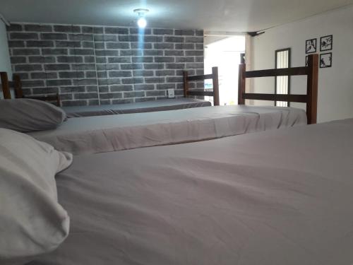 Uma cama ou camas num quarto em Hostel Bendito Descanso