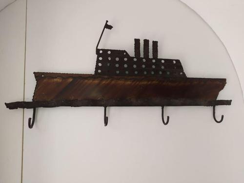 a model of a ship on a shelf on a wall at New studio in the city! in Kos Town
