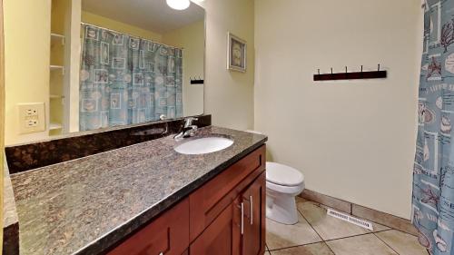 a bathroom with a sink and a toilet at Put-in-Bay Poolview Condo #4 in Put-in-Bay