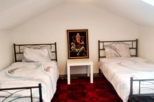 מיטה או מיטות בחדר ב-Mein Haus in Köln