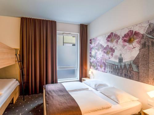 Postel nebo postele na pokoji v ubytování B&B Hotel Hildesheim