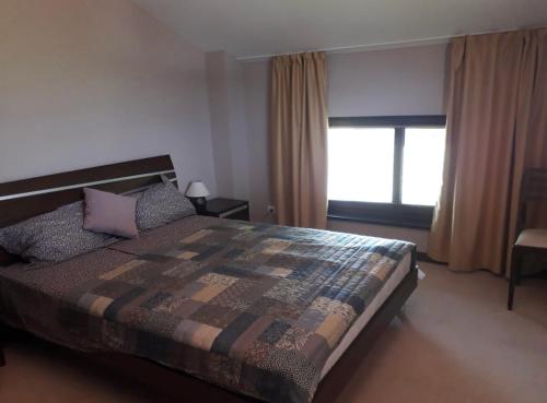 Postel nebo postele na pokoji v ubytování Apartament by Zenit in Terra Complex Massonet D28 near Bansko