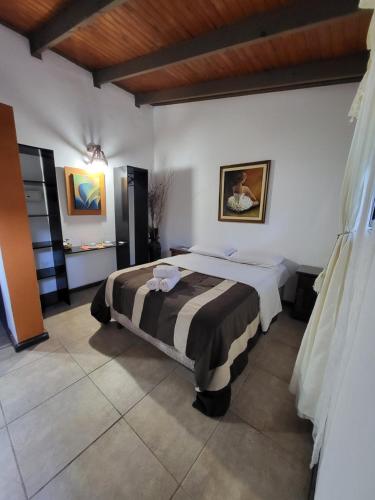 Cama o camas de una habitación en Si Mi Capitán - Cabañas & Habitaciones