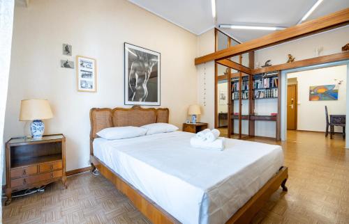 a bedroom with a large white bed in a room at Syntagma square 1 bedrm 4 persons apartment by MPS in Athens