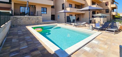 Πισίνα στο ή κοντά στο Apartment Bluemare B3 with Shared Pool