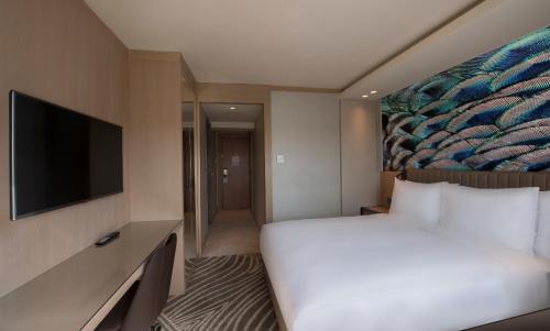 a hotel room with a bed and a flat screen tv at DoubleTree by Hilton Istanbul - Sirkeci in Istanbul