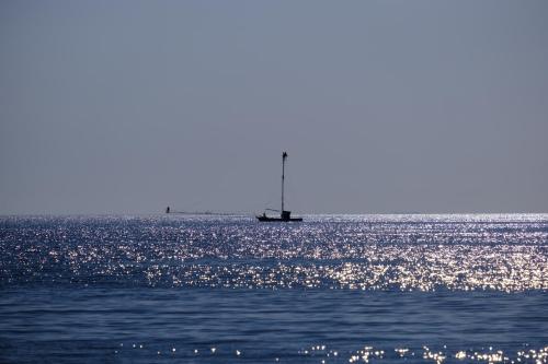a boat in the middle of the ocean at MY HOUSE URBAN LUXURY B&B in Reggio Calabria