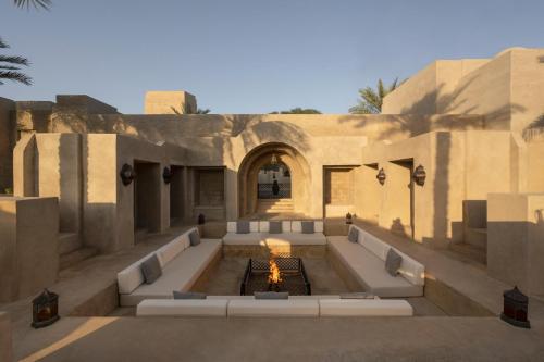 an outdoor patio with a fountain in a building at Bab Al Shams, A Rare Finds Desert Resort, Dubai in Dubai