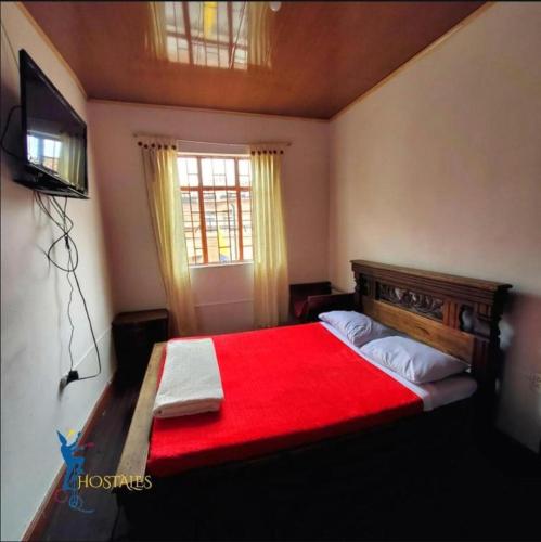 Una cama o camas en una habitación de Hostal CQ Chapinero