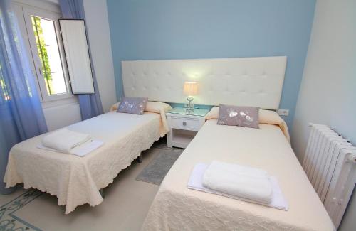 En eller flere senge i et værelse på Chalet Los 20 Pilares