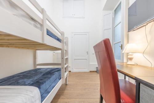 a bedroom with a desk and a bunk bed at The House of Thrones in Viterbo