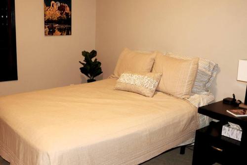a bedroom with a bed with a pillow on it at Phoenix Home with heated pool, desert views & hot tub in Anthem