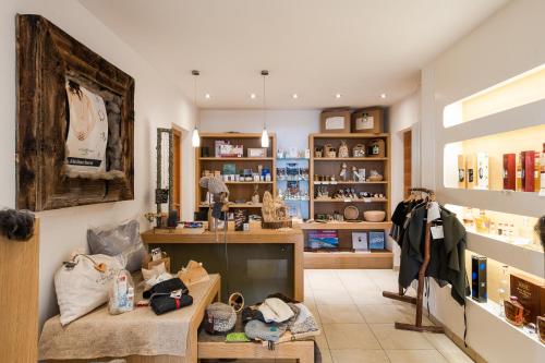 a room with a store with a lot of merchandise at Naturhotel Rainer in Racines