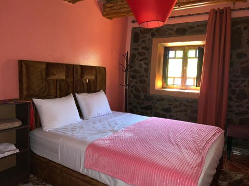 Postel nebo postele na pokoji v ubytování Oussaya House