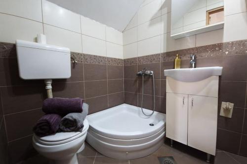 a bathroom with a toilet and a sink at Airport Studio Loft - Galleria in Belgrade