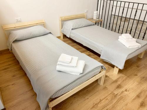 Una cama o camas en una habitación de IL RIFUGIO BAROCCO