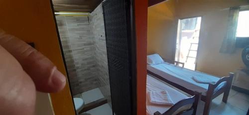 Postel nebo postele na pokoji v ubytování ROSÁRIO TEMPORADA Hostel