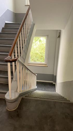 a staircase with a window in a house at City Fever in Hannover