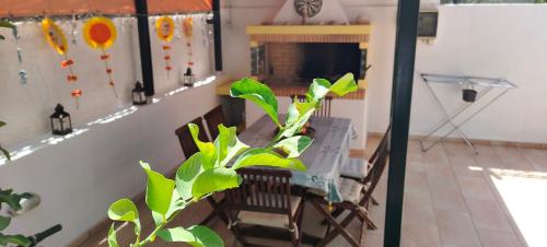 a living room with a table and chairs and a fireplace at Natageo in Loutraki