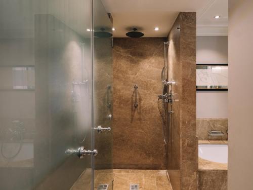 a shower with a glass door in a bathroom at Hotel Sacher Salzburg in Salzburg