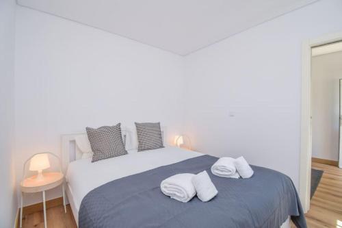 Postel nebo postele na pokoji v ubytování Acolhedor Apartamento de 1 Quarto com Terraço