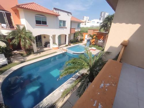 a swimming pool in the backyard of a house at Casa /alberca, chapoteadero, mirador, wifi in Veracruz