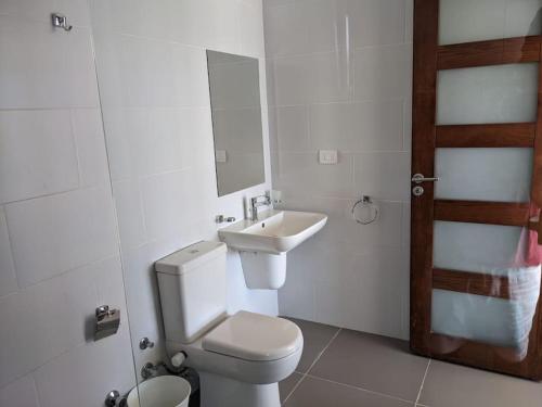 a bathroom with a toilet and a sink at Sea & Golf Views 2BR Villa with Free Beach & Pool Access in Hurghada