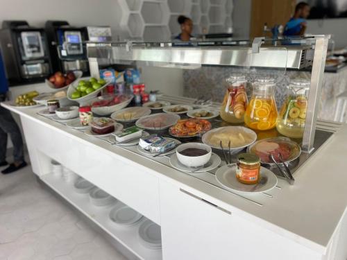 a buffet line with many different types of food at Ouril Mindelo in Mindelo