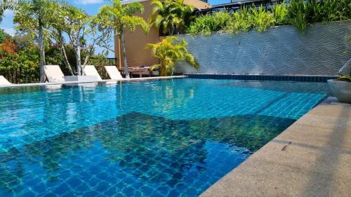 a swimming pool with blue water in a resort at Pinnacle boutique villas in Galle