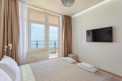 Postel nebo postele na pokoji v ubytování Direct sea view